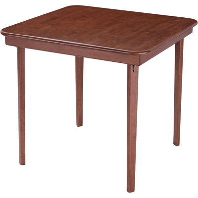 a square wooden table with one leg extended and the other end turned slightly to the side