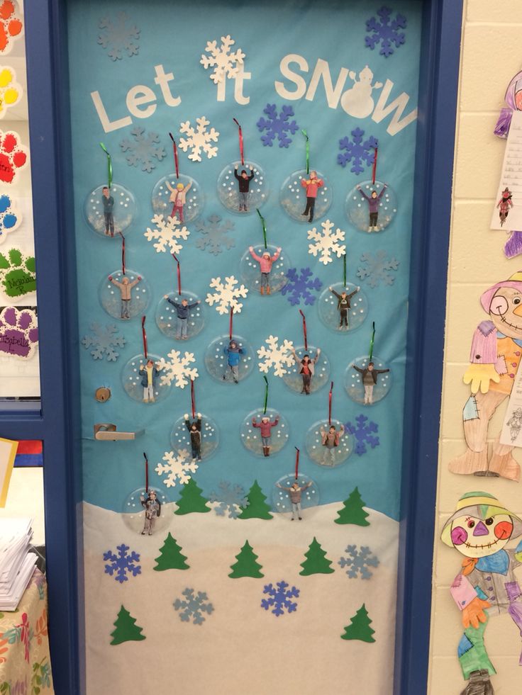 a classroom door decorated with snowflakes and candles for the winter holidays in front of it