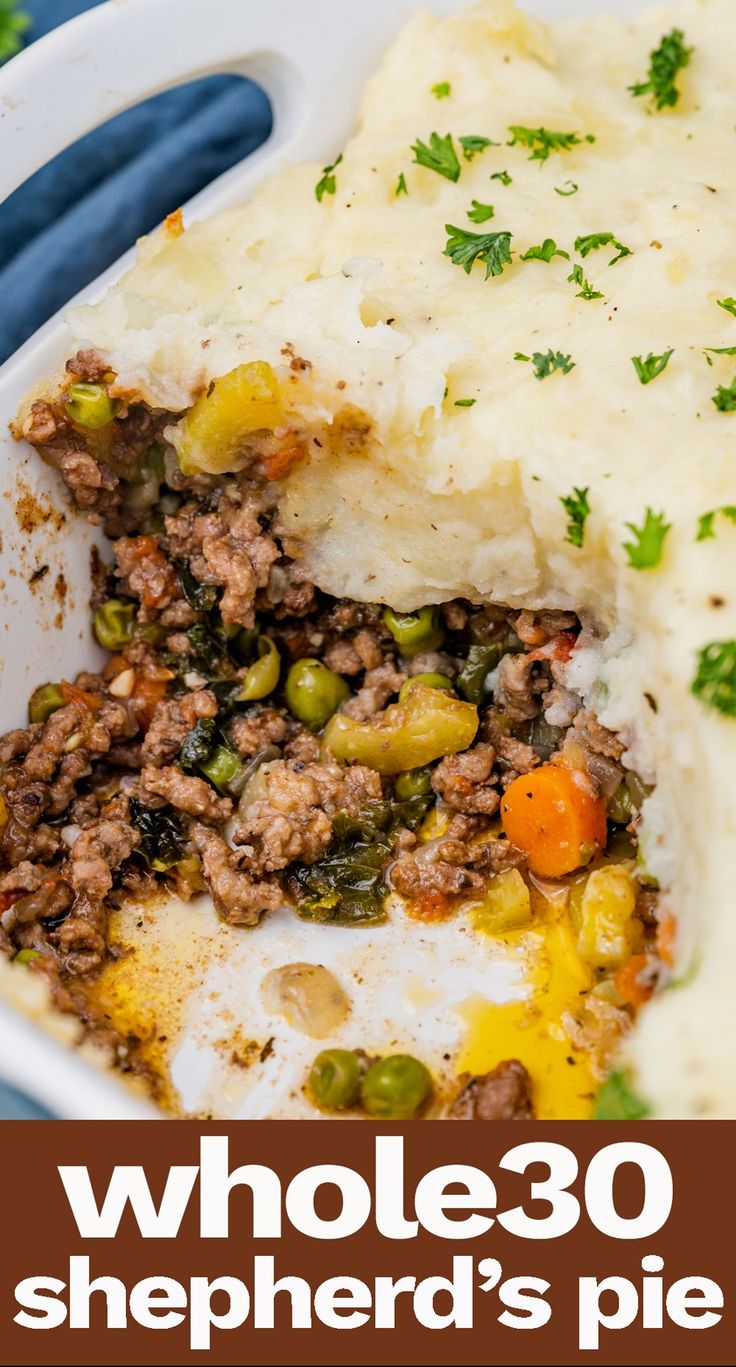 a white plate topped with mashed potatoes and meat