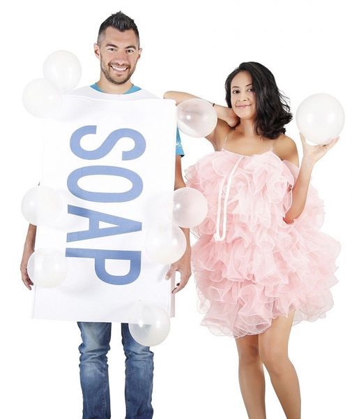 a man and woman are dressed up as soap for the camera while holding balloons in front of them