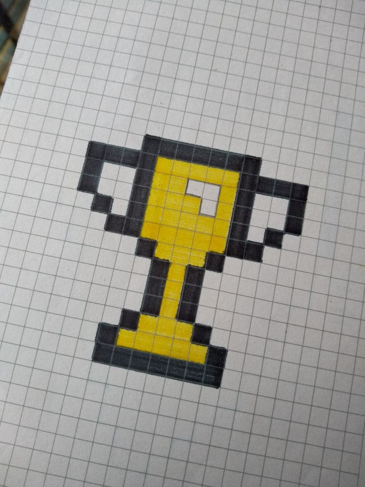 an image of a pixelated cup on the side of a piece of paper that looks like it is holding a tennis racquet