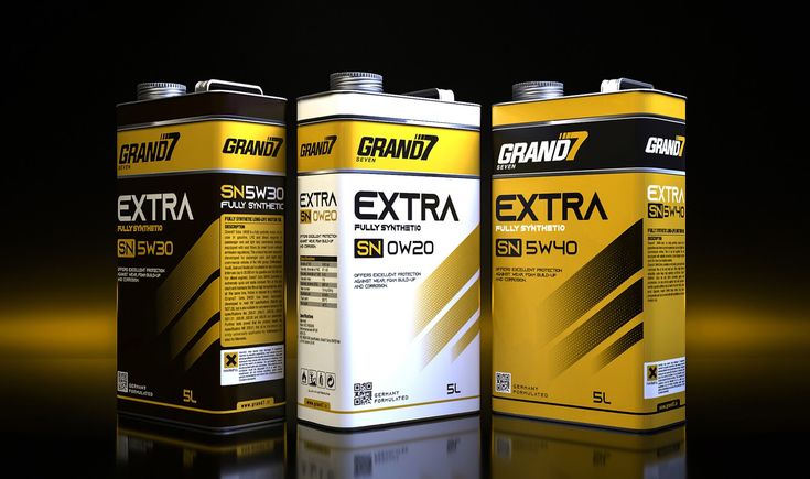 three cans of brand 7 extra high performance engine oil on a black background with reflections