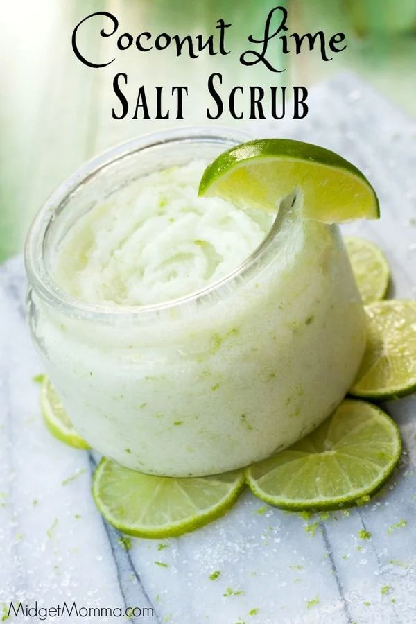 coconut lime salt scrub in a glass jar with limes around it and the words coconut lime salt scrub