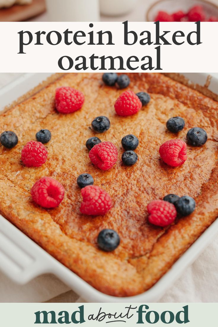 a close up of a pancake with berries on top and the words protein baked oatmeal above it