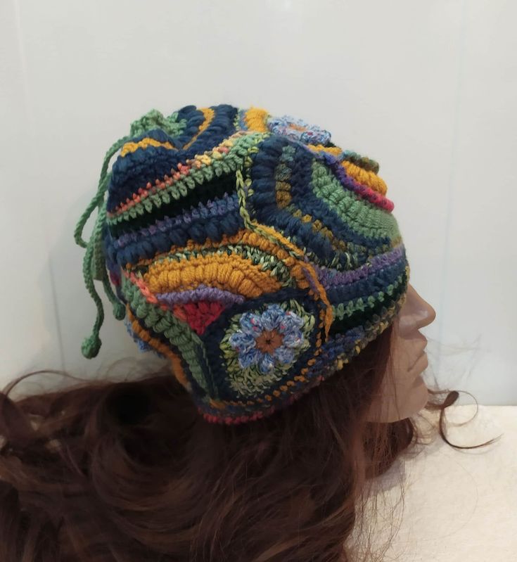 "A soft warm crochet  multicolor ( yellow, blue, green) Women  beanie hat  in boho style. This hat  made in a unique pattern that cannot be repeated exactly. Perhaps an approximate repetition.  This is a flight of fantasy and intuitive knitting. In this knitted set you will be unique, irresistible and delightful. This hat has no seam and you can turn it in any way and change your look.   This Beanie is sure to be the perfect accessory for your fall and winter wardrobe. It is stylish, functional, Multicolor Crochet Yarn Cap, Hand Knitted Multicolor Crochet Hat, Hand Knitted Multicolor Crochet Hat In Yarn, Multicolor Crochet Cap Hat, Multicolor Hand Knitted Crochet Hat, Multicolor Crochet Cap In One Size, Multicolor Crochet Cap One Size, Multicolor Crochet Cap, One-size Multicolor Crochet Cap