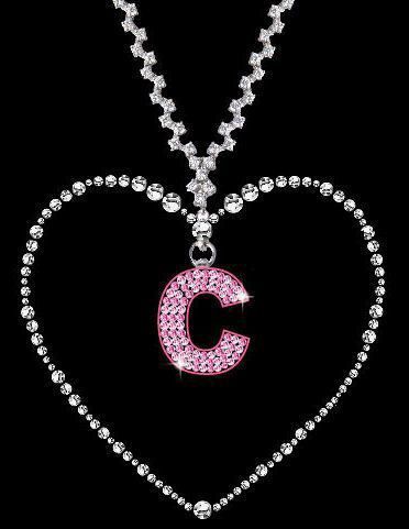 a heart shaped necklace with the letter c hanging from it's center, surrounded by diamonds