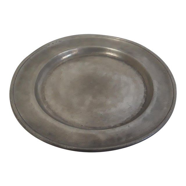 an oval metal tray on a white background