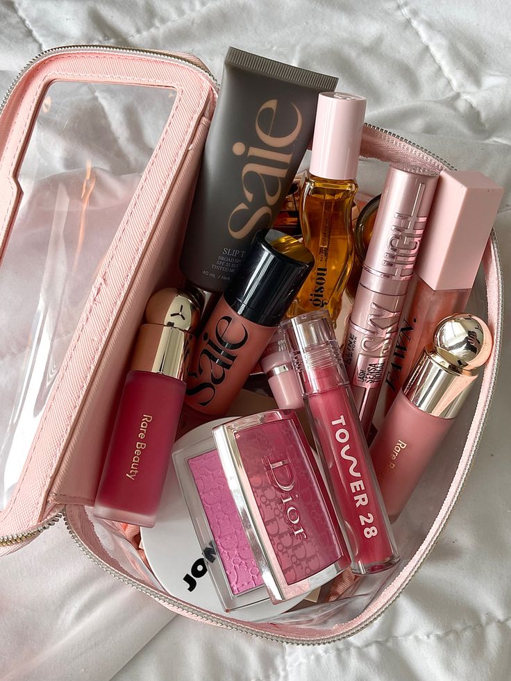 Makeup bag makeup flatlay rare beauty Dior pink blush viral makeup makeup flatlay Makeup Bag Essentials, Smink Inspiration, Fancy Makeup, Makeup Needs, Makeup Aesthetic, Makeup Obsession, Pink Makeup, Bag Essentials, Makeup Items