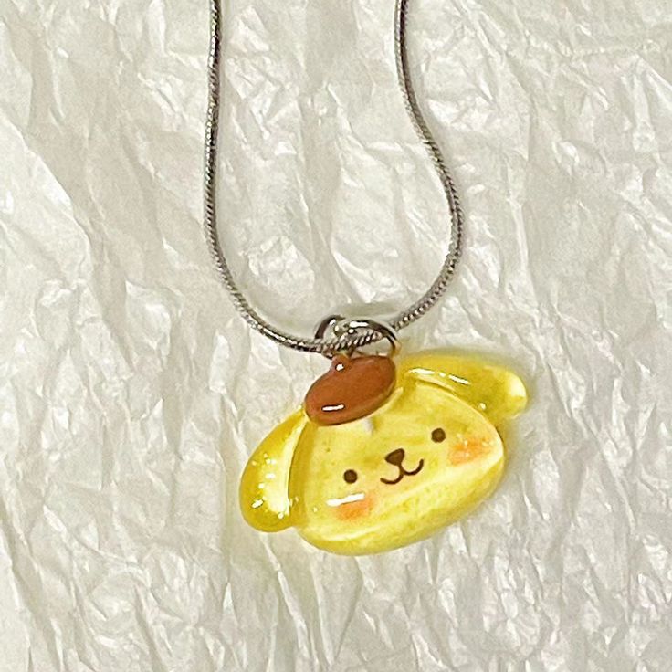 📿 Sanrio Kawaii Necklace Pendant - Adorn Yourself with Cuteness 📿 ✨ Charming Adornment: The Sanrio Kawaii Necklace Pendant isn't just any necklace; it's a delightful accessory that adds charm and style to your attire. Featuring various beloved Sanrio characters, this pendant brings a touch of cuteness to your fashion choices. 💖 Charming Design: With iconic Sanrio characters adorning this pendant, every time you wear it, you celebrate the timeless charm and cuteness of your favorite friends. I Kawaii Jewelry With Cute Adjustable Design, Adjustable Cute Kawaii Jewelry, Adjustable Kawaii Jewelry With Cute Design, Cute Adjustable Clavicle Chain Necklace, Cute Charm Necklaces For Gifts, Cute Pendant Necklace For Friendship, Cute Friendship Pendant Necklace, Kawaii Handmade Silver Necklaces, Kawaii Pendant Jewelry Gift