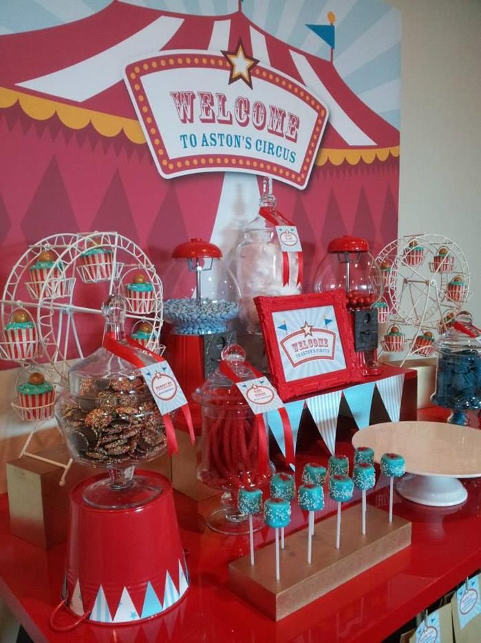 a carnival themed dessert table with candy and candies