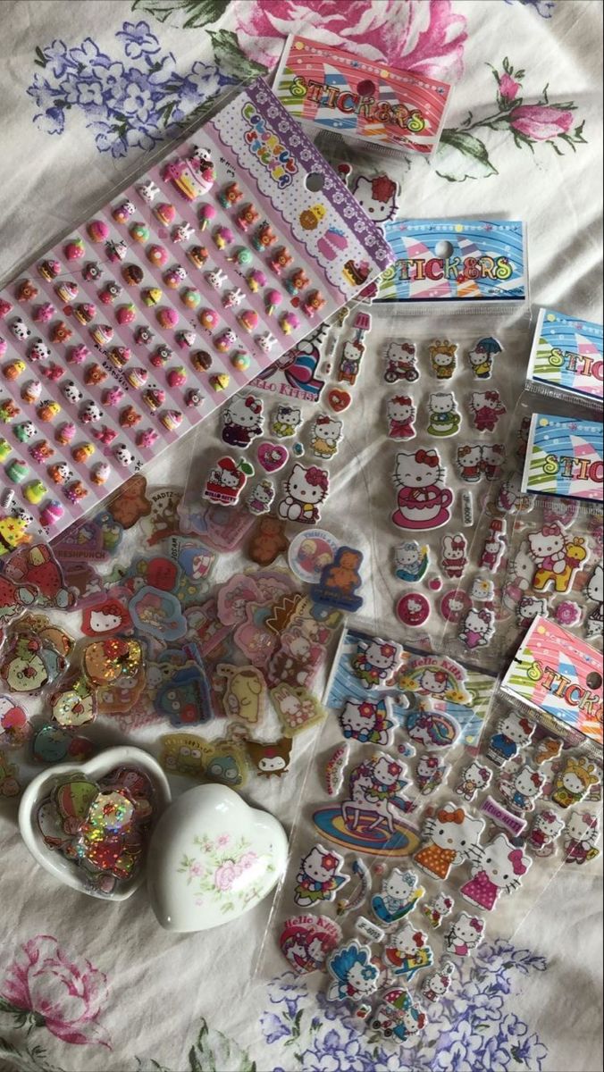 there are many stickers and magnets on this bed sheet, including hello kitty