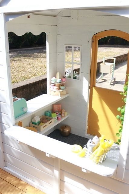 the inside of a doll house with its door open