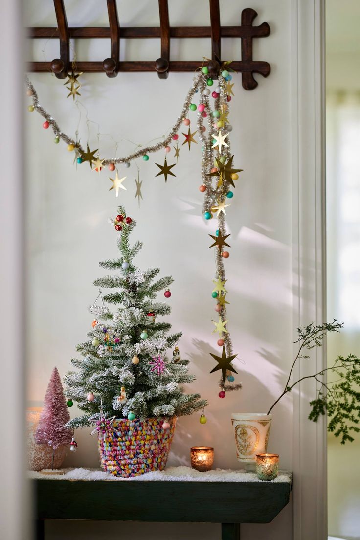 Faux Potted Snowy Fir Tree, 2.5’ | Terrain Anthropologie Christmas Display, Anthropologie Christmas Tree, Basket Tree, Anthropologie Christmas, Mini Basket, Winter Woods, Holiday Deco, Tinsel Garland, Rag Rugs