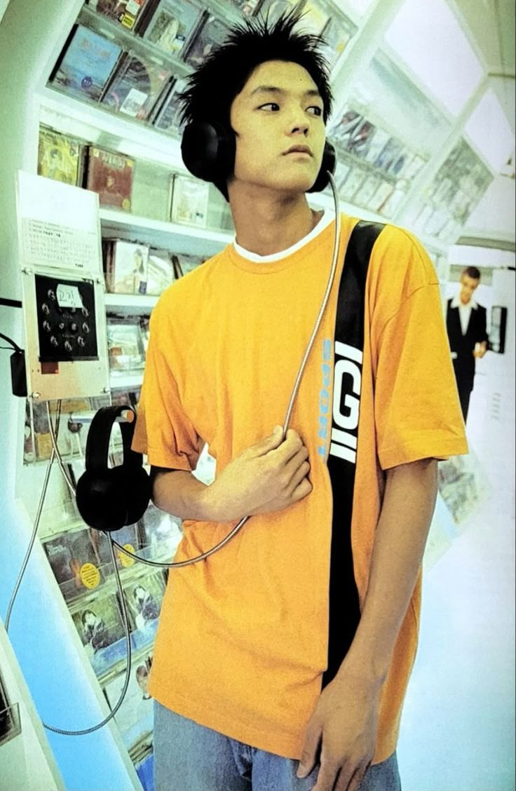 a young man wearing headphones in a store