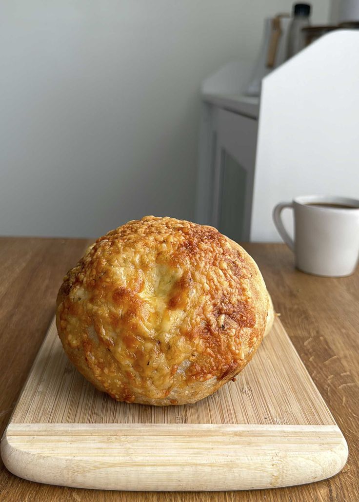 a close up of a muffin on a cutting board