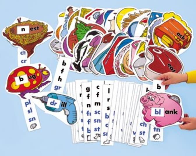 a person holding up several different kinds of stickers