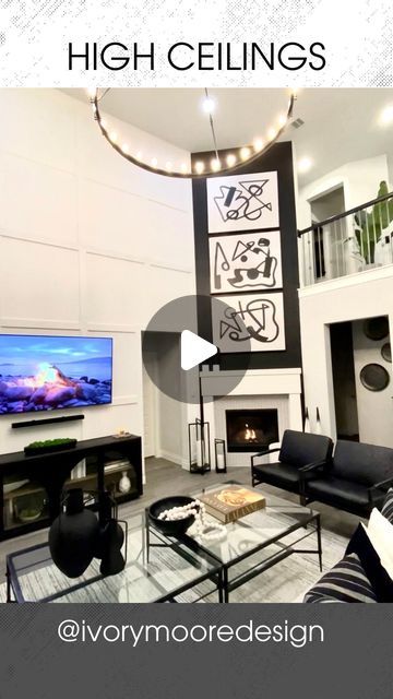 a living room filled with furniture and a flat screen tv mounted on the wall above a fireplace