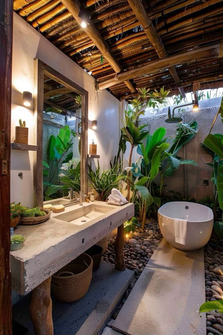 a bathroom with a sink, tub and plants