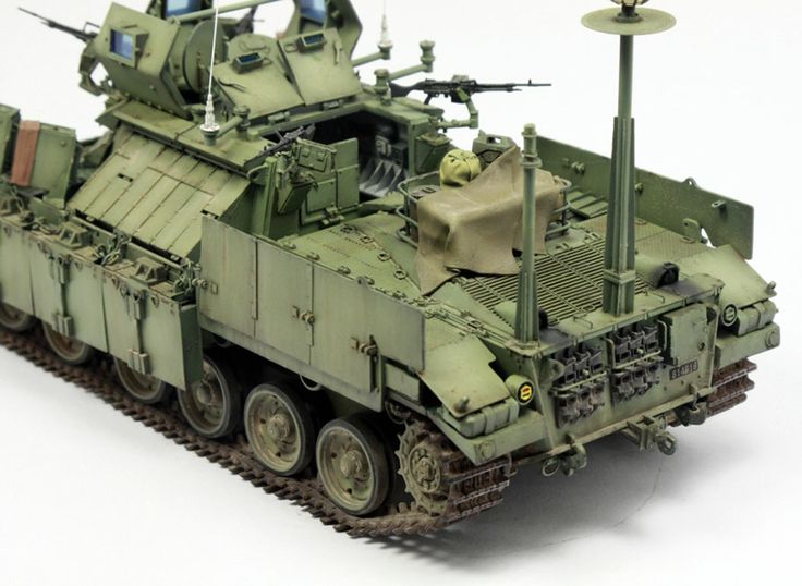 a toy army vehicle is shown on a white background