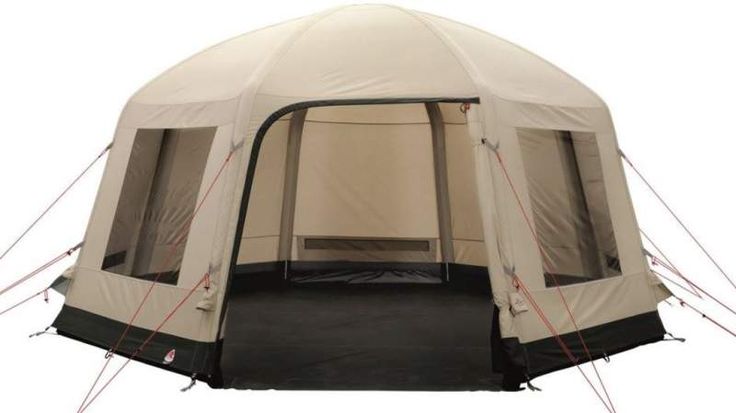 a tent that is set up with the door open and windows closed to let in light