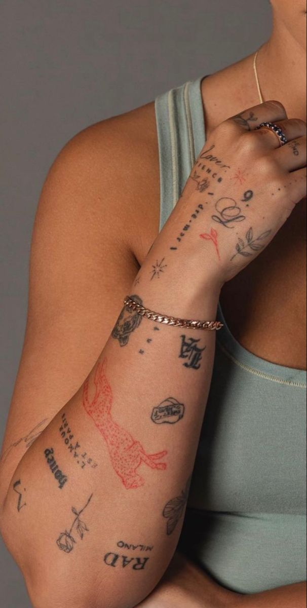 a woman with many tattoos on her arm