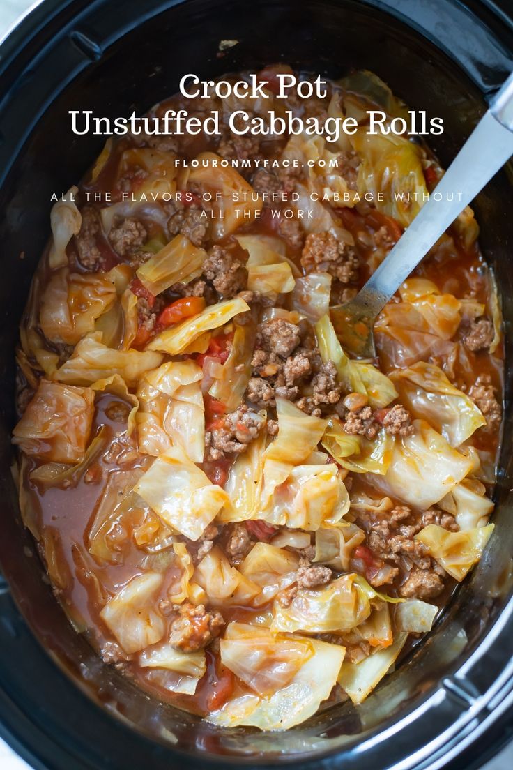 the crock pot is filled with cabbage rolls and meats for an easy dinner