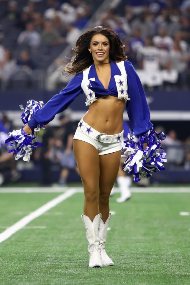 a cheerleader is dancing on the field