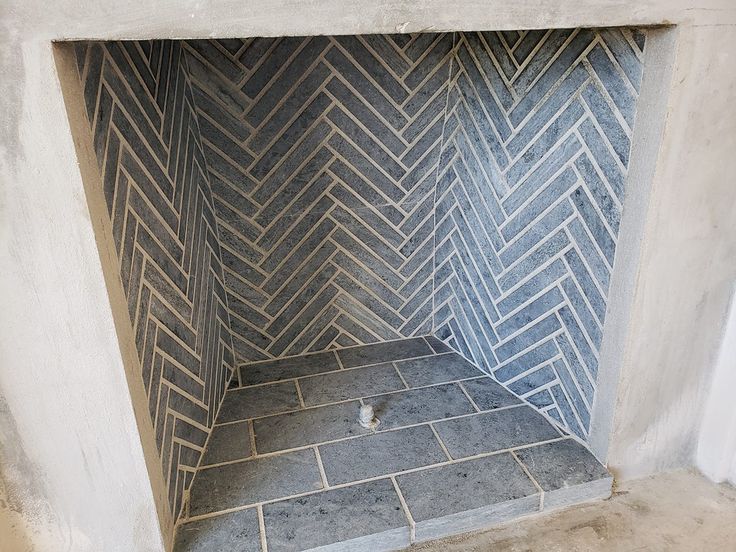 a bathroom with a tiled floor and walls