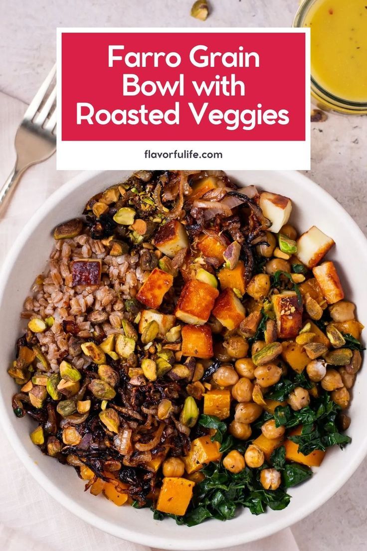 a bowl filled with farro grain and roasted veggies next to a glass of orange juice