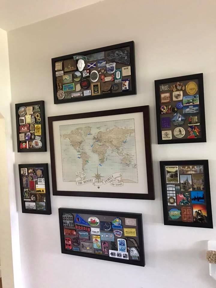 there are many framed pictures on the wall