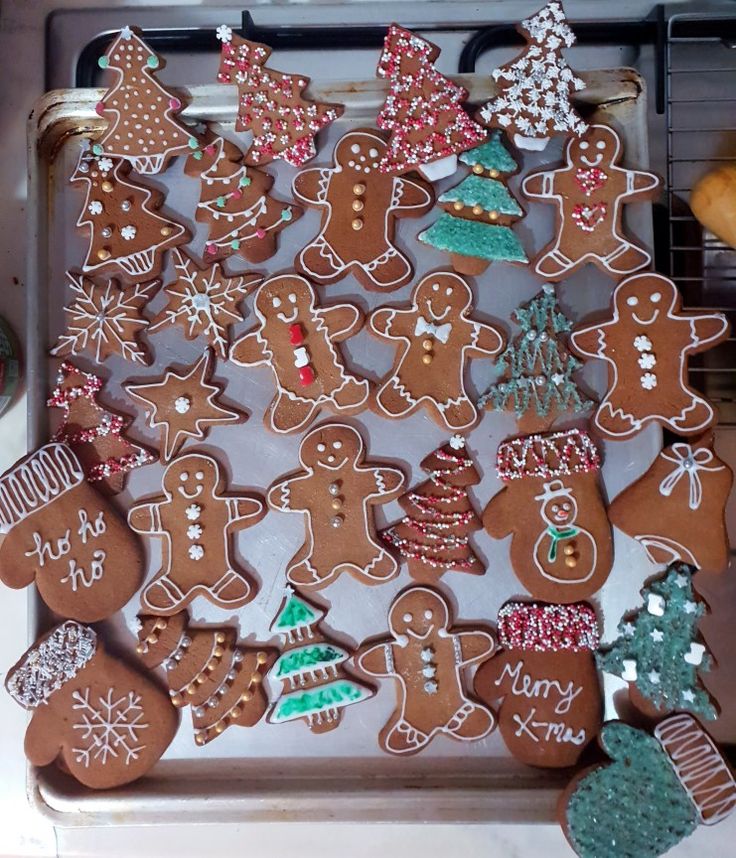 many different kinds of gingerbread cookies on a baking sheet