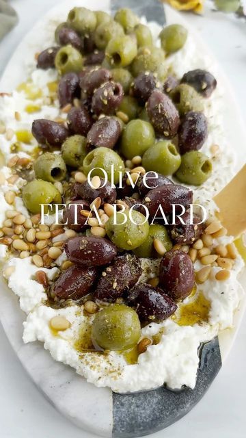 olives, feta and pine nuts on top of a plate with text overlay