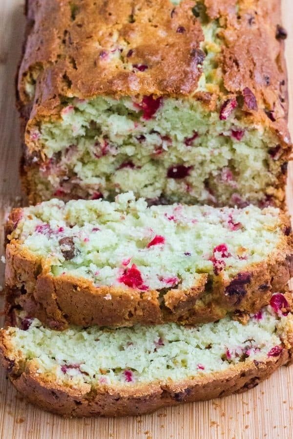 a loaf of cranberry bread on a cutting board