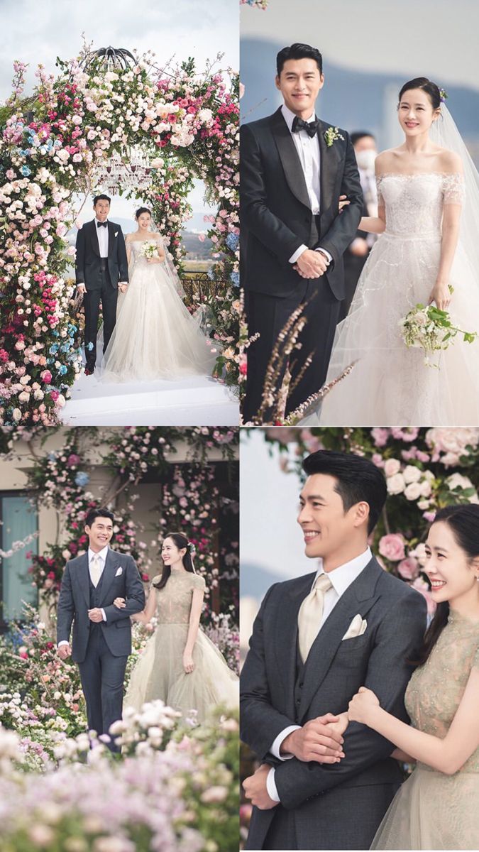 the bride and groom are walking down the aisle at their wedding ceremony with flowers all around them