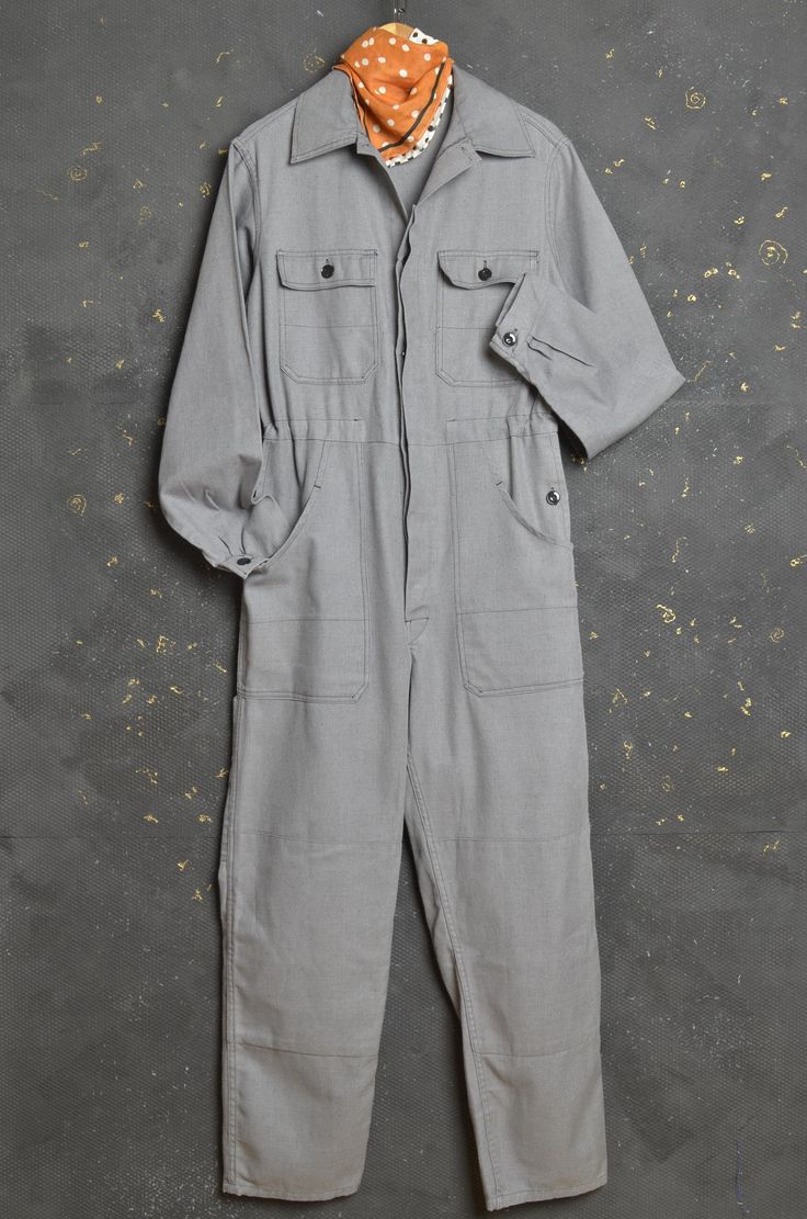 Great Vintage French Workwear Overall Looks like Size Small / Medium 100% Cotton Twill Super comfortable jumpsuit from durable cotton fabric Concealed button front fastening  Two Buttoned chest pocket  Long sleeves, buttoned cuffs Draw string waist Great vintage condition, brushed and sun faded with lovely patina, super comfortable to wear, with signs of wear, repairs, some spots and plenty of life left to give! PLEASE CHECK ALL MEASUREMENTS TO ENSURE BEST FIT, THANK YOU!  Pit to pit: 20.5" Shou Workwear Jumpsuit, French Workwear, Nape Of Neck, Boiler Suit, Dungarees, Vintage French, French Vintage, Herringbone, Cotton Twill