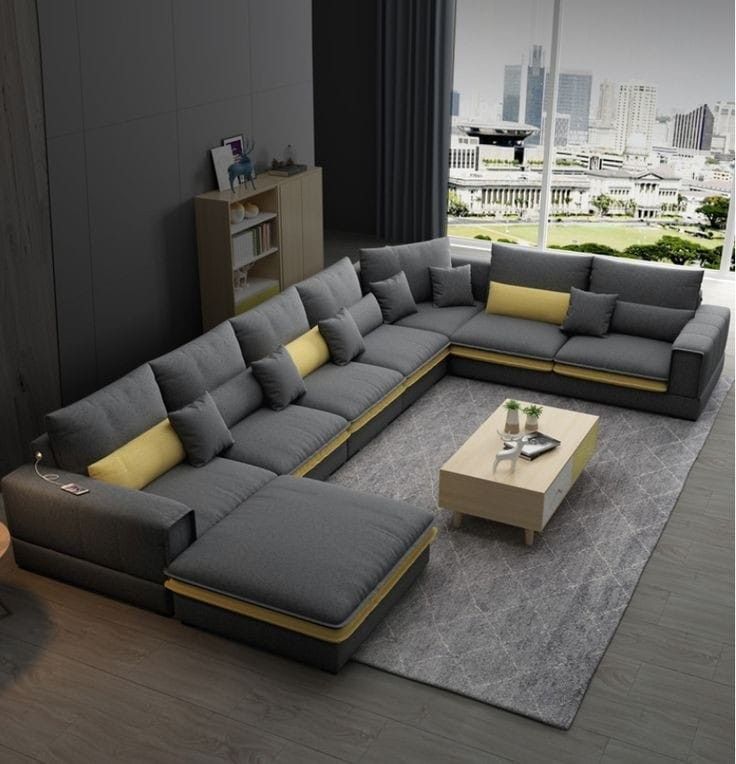 a modern living room with grey and yellow furniture