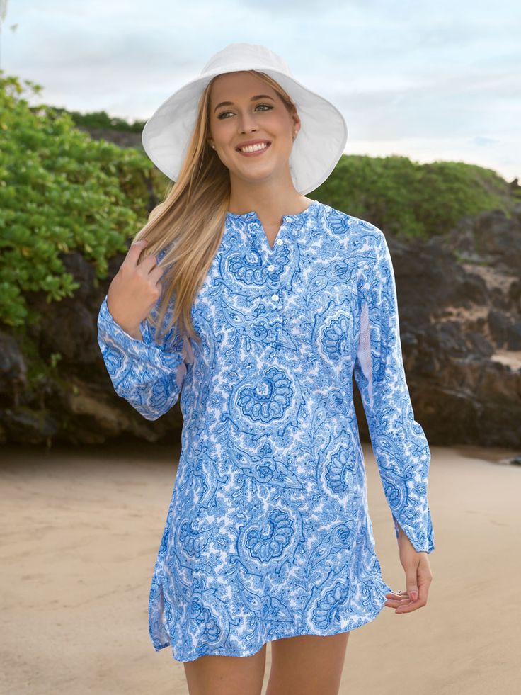 <h2 class="mti_font_element">Pretty. Lovely. Beautiful. You could go through a whole roster of adjectives and still not do justice to our Women’s Beach Tunic. It has richly detailed contrasting floral embroidery (solid color body only) on the front yoke, a jewel neckline with a stylishly long placket and princess seams that flatter (not accentuate) curves. Drama comes from the tapered, vented sleeves with slightly flared cuffs. Shell buttons add charm and underarm mesh adds coolness. Wear a... Beach Coverup Pattern, Beach Tunic, Sun Shirt, Jewel Neckline, Princess Seams, Shell Buttons, Woman Beach, Shirts For Women, Princess Seam