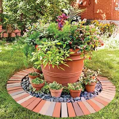 a potted planter sitting in the middle of a garden