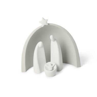 a white ceramic nativity set with three candles and a star on the top, in front of an arch