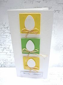 an easter card with three colored eggs on it and a ribbon tied around the top