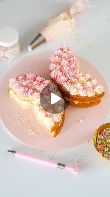 two pieces of cake sitting on top of a pink plate with sprinkles