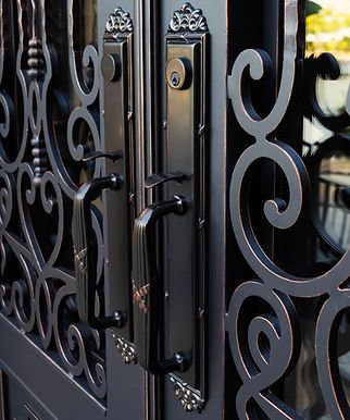 an iron gate with decorative designs on the sides and side panels is seen in this image