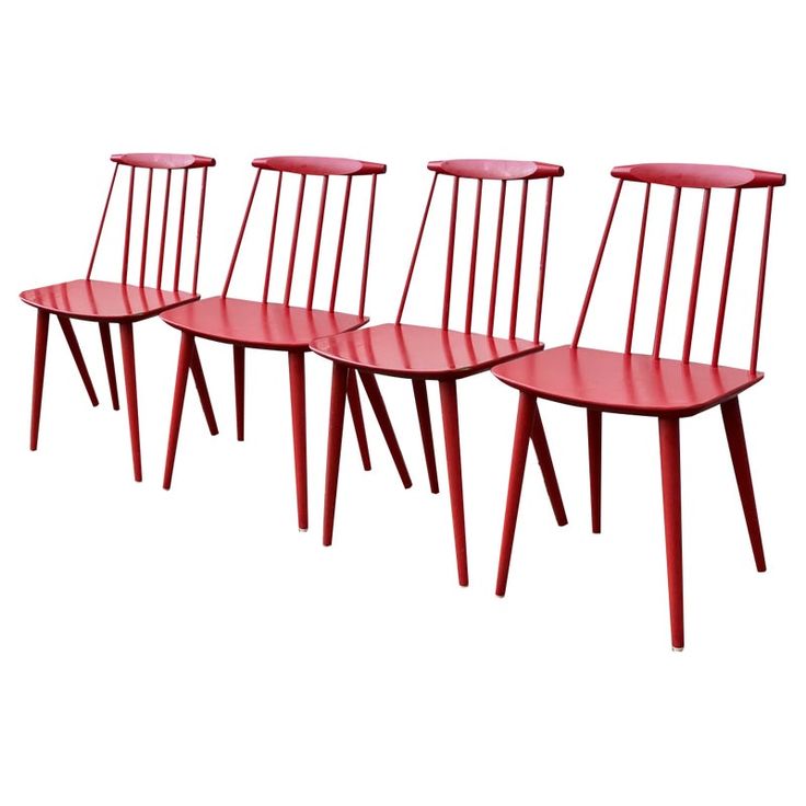 four red chairs sitting next to each other