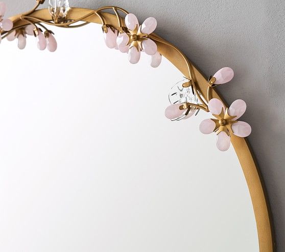 a mirror that has some flowers on it