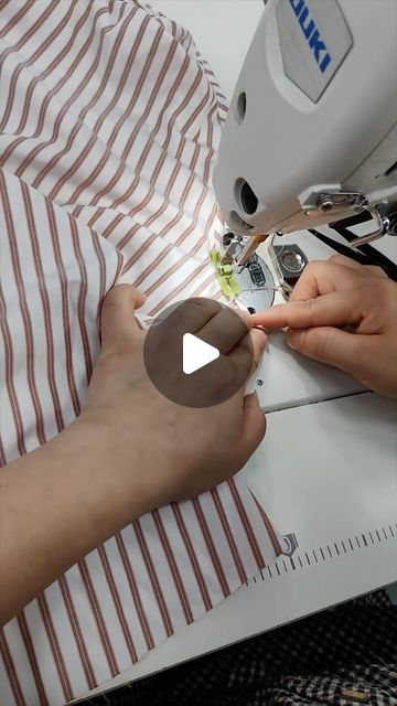 someone is using a sewing machine to sew something