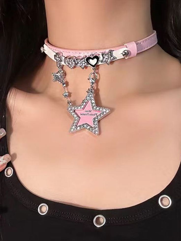 This pink and white PU choker comes in two styles for you to choose from. One features decorations of stars, hearts, a cross, and a heart pendant, while the other features heart and star decorations with a star pendant. Both options are perfect for adding a touch of sweetness and charm to your outfit. Made with high-quality materials, these chokers are perfect for anyone who loves Lolita or kawaii fashion. Add a whimsical and adorable touch to your look with these lovely chokers.  The price is f Trendy Pink Jewelry With Star Charm, Pink Punk Necklace For Party, Pink Punk Jewelry For Party, Pink Punk Style Necklace For Party, Trendy Pink Star-shaped Jewelry, Pink Punk Choker For Gift, Pink Punk Choker As Gift, Pink Punk Choker As A Gift, Punk Style Pink Choker Gift