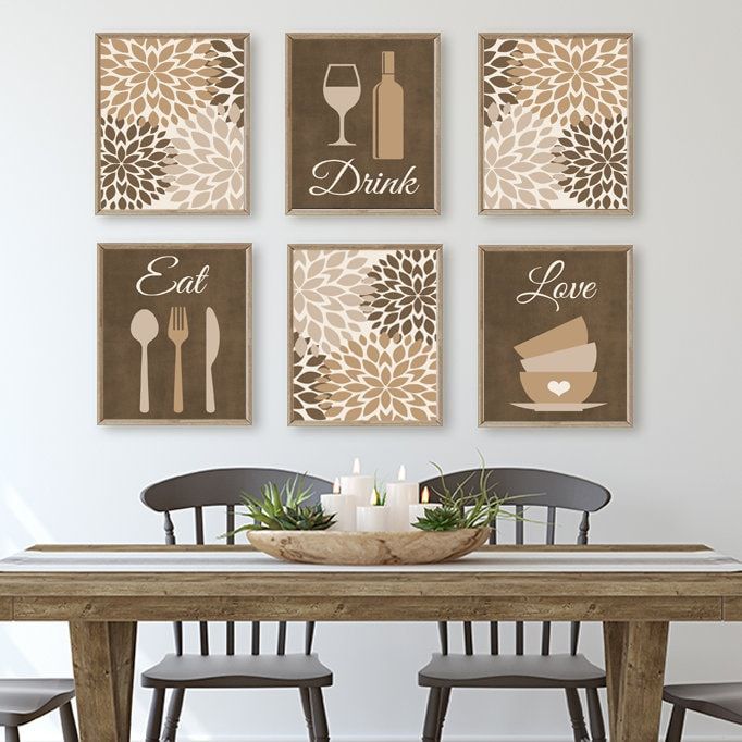 a dining room table with chairs and pictures on the wall above it that says eat, drink, love