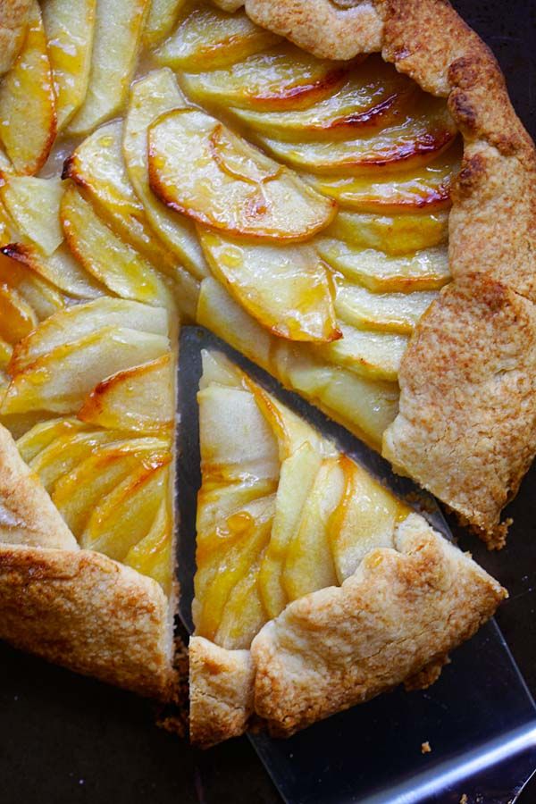 an apple pie is cut into slices and ready to be eaten