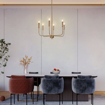 a dining room table with chairs and a chandelier