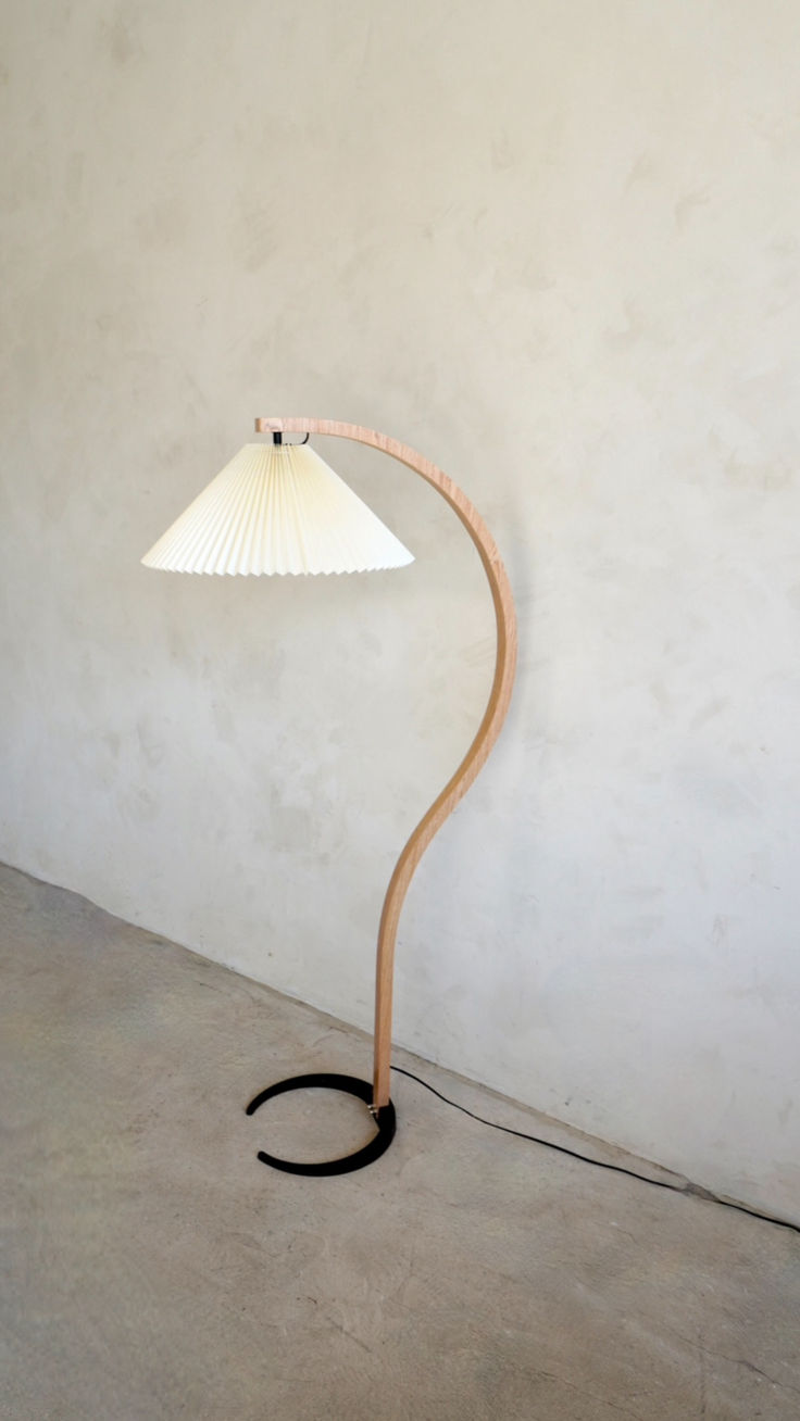 a lamp that is on top of a wooden pole in the corner of a room